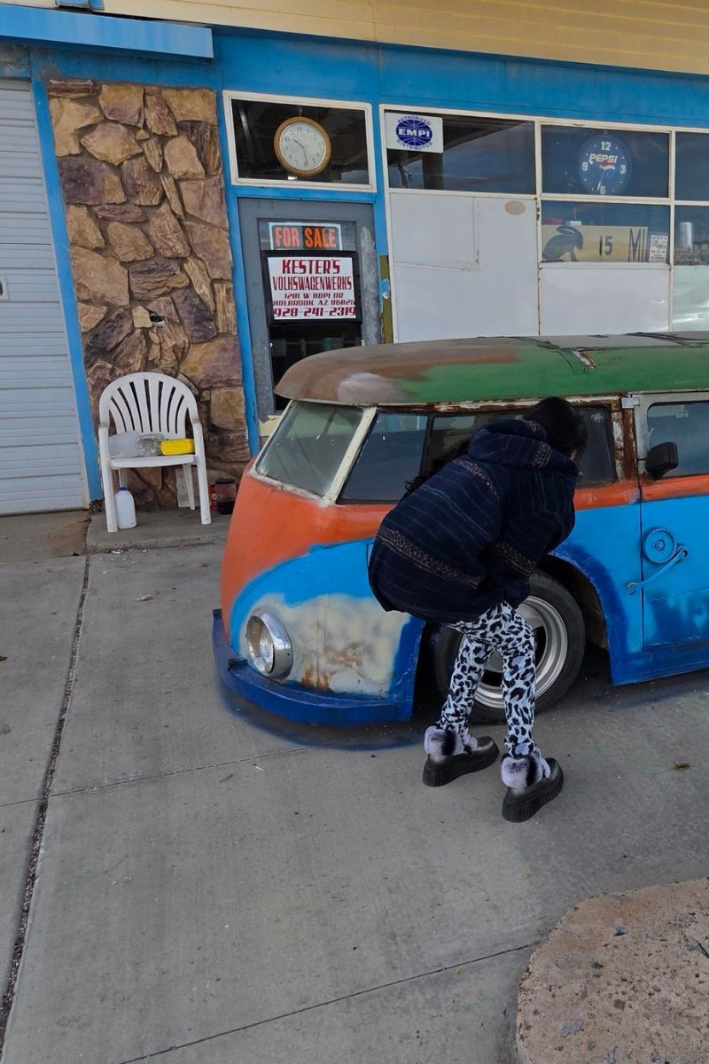 Blue car at colorful shop